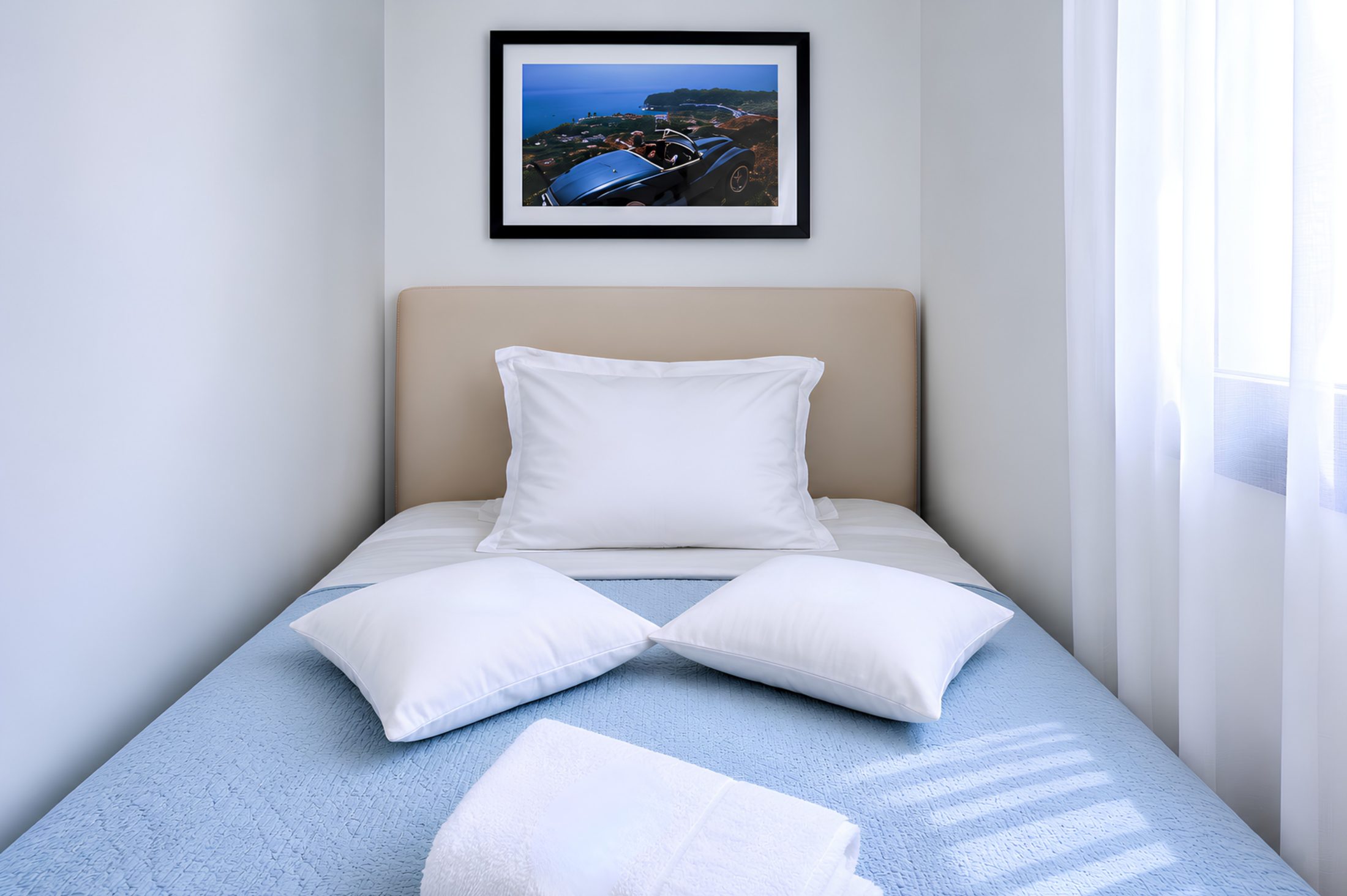 Bedroom suite with coastal artwork